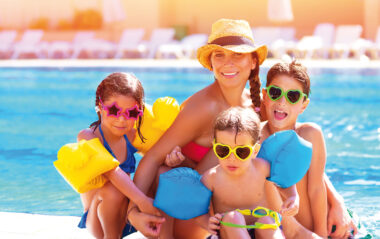 Happy family at the pool